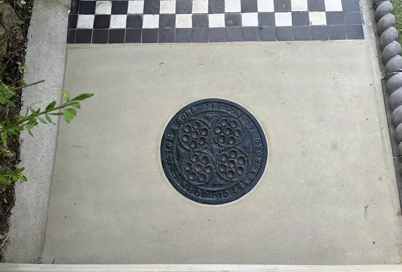 Waterproofed coal hole cover