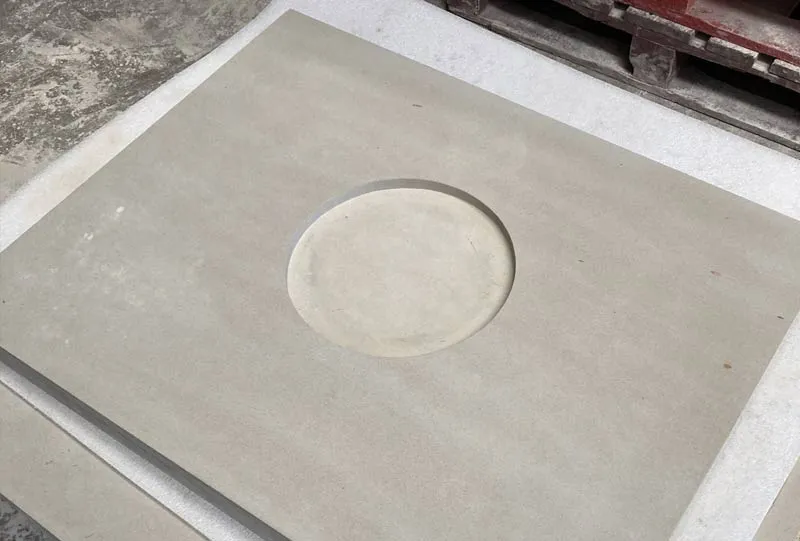 Stone for a waterproofed coal hole cover