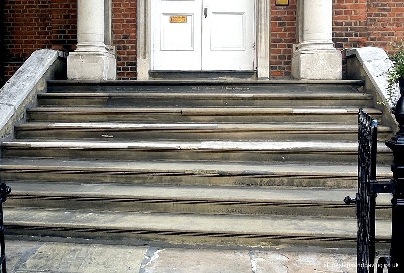 Before restoration: Worn and cracked Yorkstone entrance steps