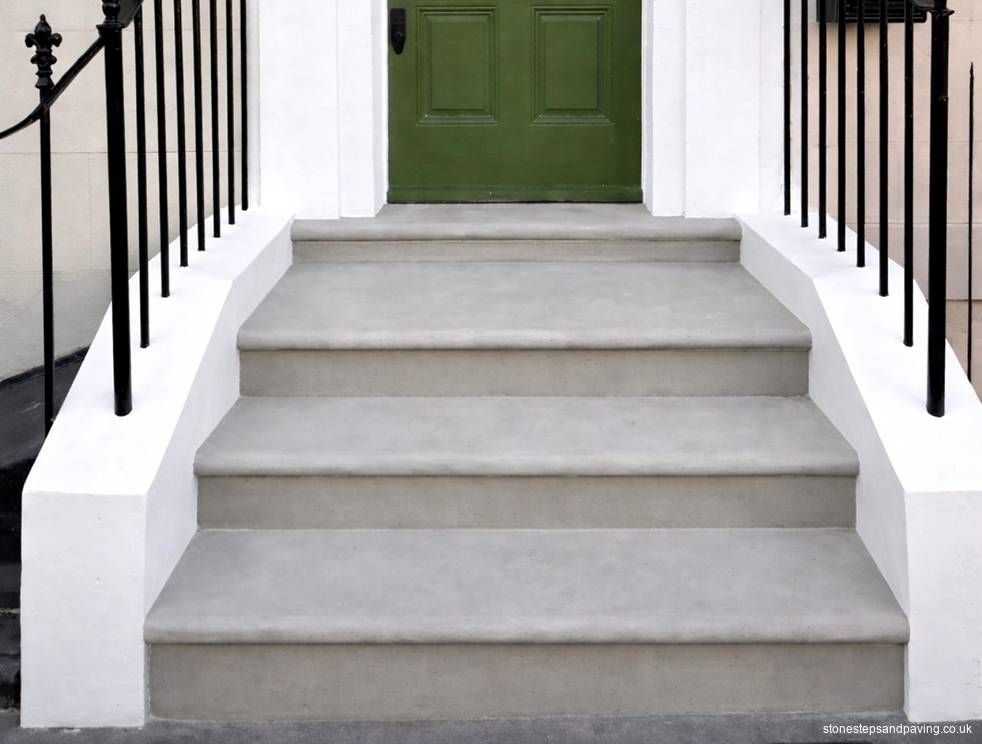 New Yorkstone entrance steps with bullnosed treads for a home in Penzance Place, Notting Hill W11 Completed Yorkstone entrance steps with bullnosed treads between white rendered walls and black railings, Penzance Place, Notting Hill W11